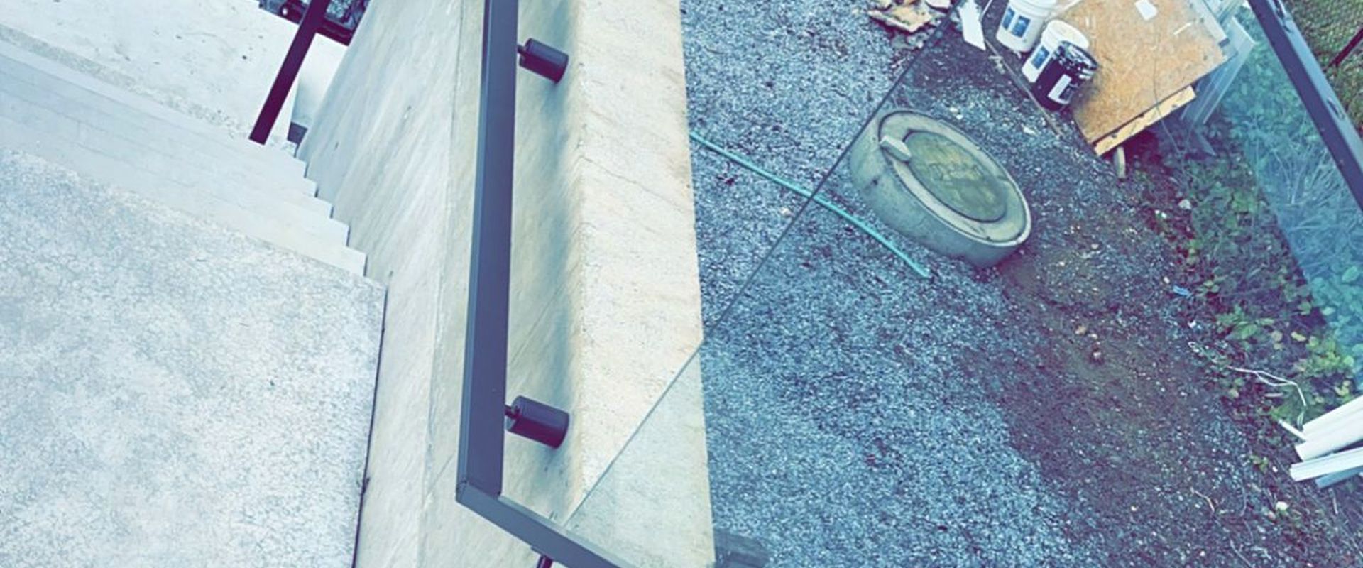 Custom glass stair railing installation