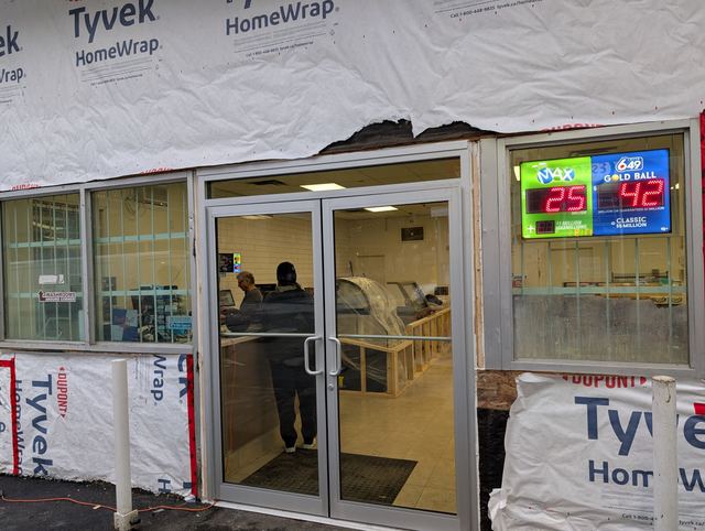 Commercial glass entry doors during renovation