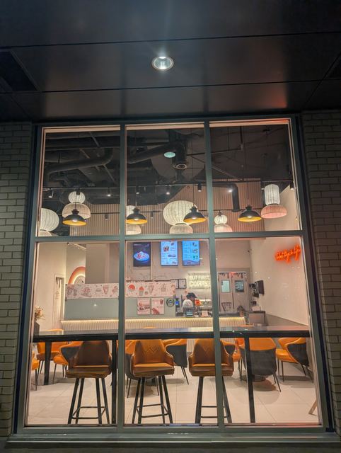 Restaurant storefront windows at night