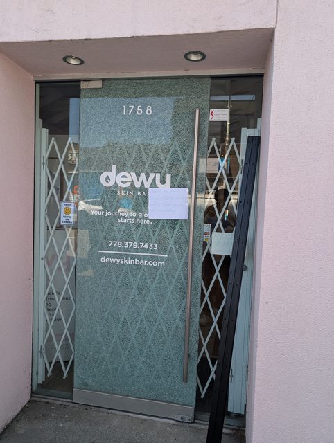 Storefront entry door fitted with a folding security gate