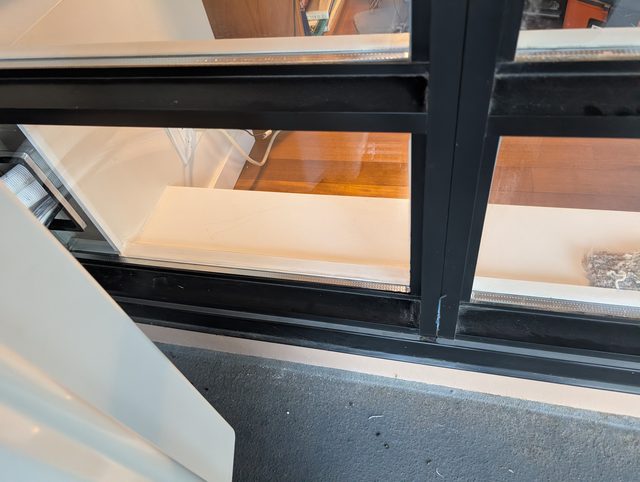 Close-up of a storefront frame and transom head after reglazing