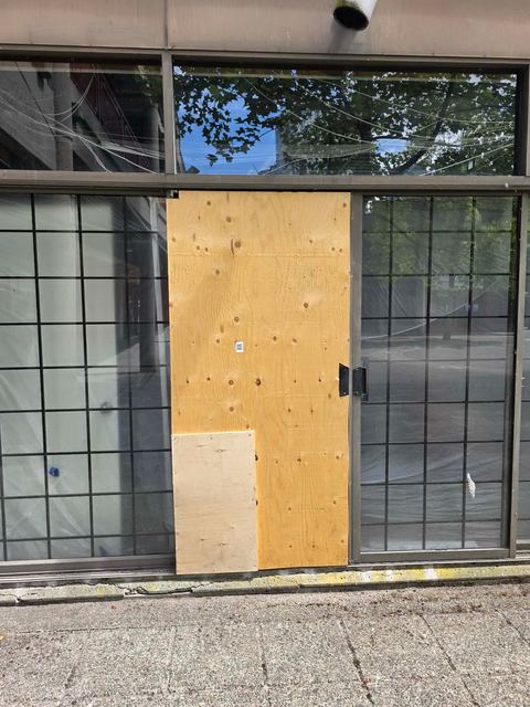 Emergency board-up beside glass block windows