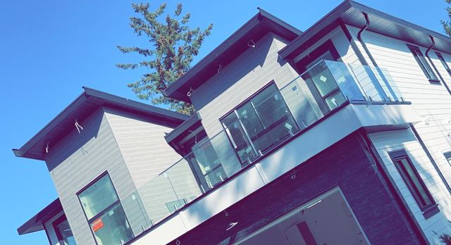Exterior glass balcony railings on a new home