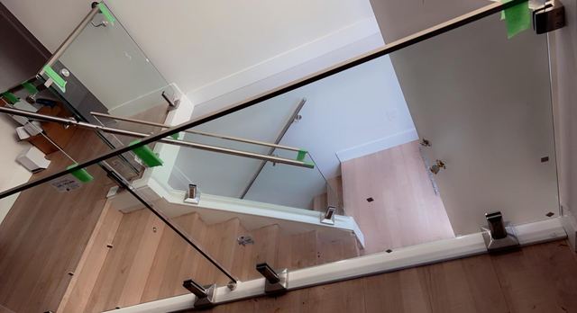 Glass stair railing hardware detail