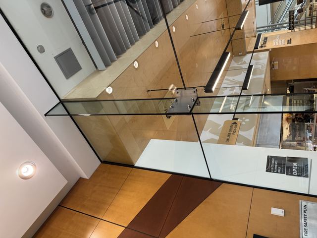 Glass railings wrapping a stairwell