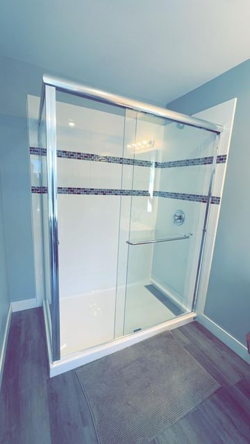 Black grid-frame glass shower door