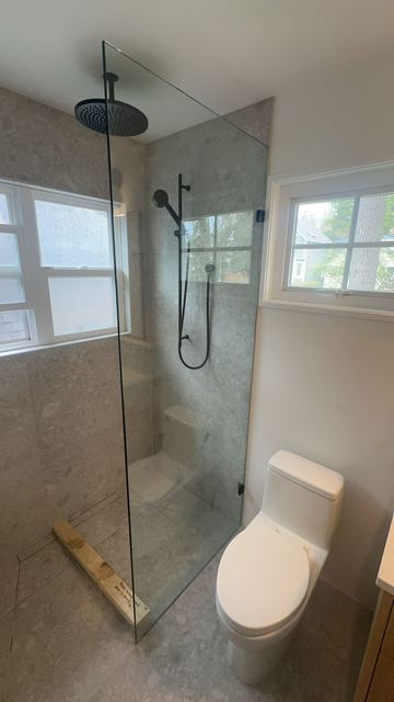 Frameless corner shower with chrome hardware