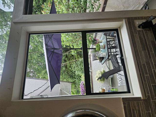 Open vinyl awning window after glass replacement