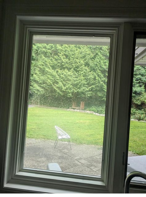 Hazy failed sealed unit beside a clear pane for comparison