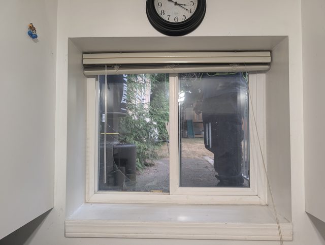 Detail of a roller-shutter window opening during glass replacement