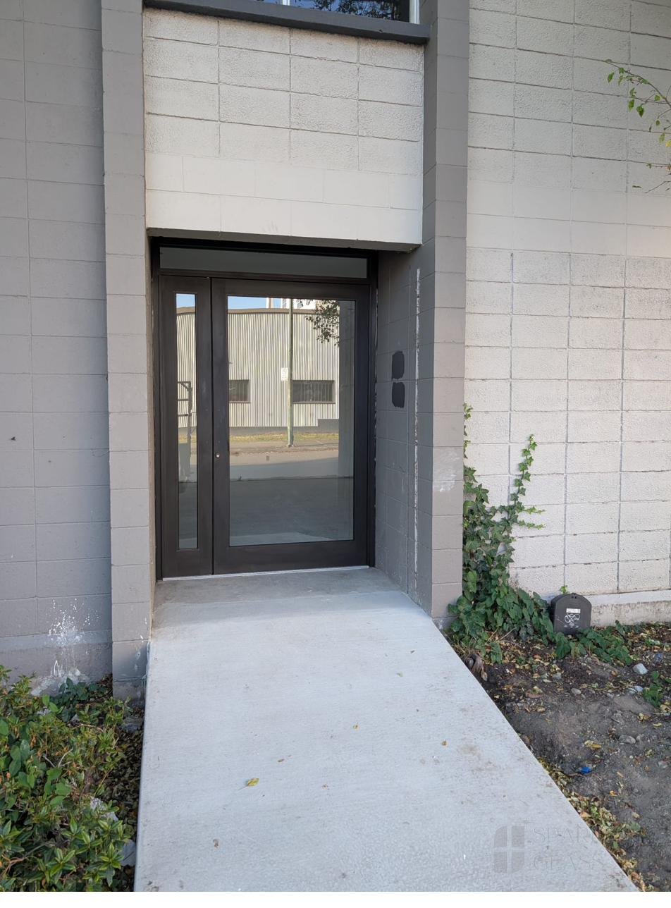 Commercial aluminum entry door and storefront glass in Vancouver